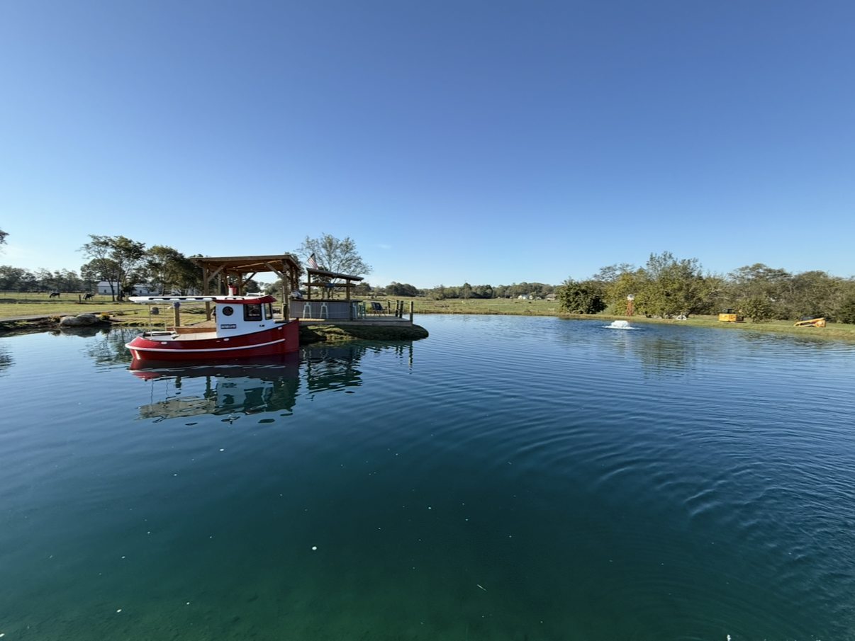 Custom finished pond with dock and boat, Middle Tennessee